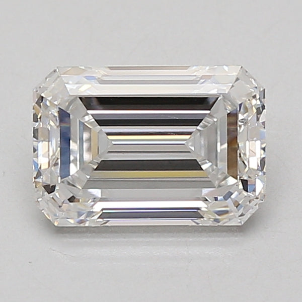 Emerald-cut lab-grown diamond with faceted sides and stepped pavilion, displaying light refraction across clear surface.