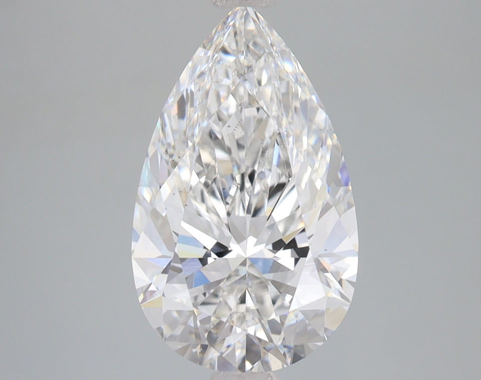 Pear-shaped lab-grown diamond with faceted surfaces and bright light refraction on gray background.
