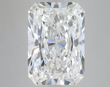 Radiant cut lab-grown diamond with faceted surfaces and clear brilliance on neutral gray background.