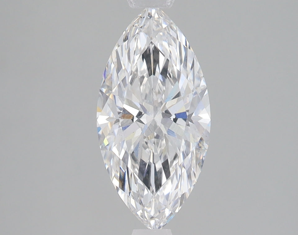 Marquise-cut faceted diamond with clear facets and light refraction against neutral gray background.