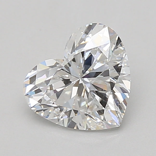 Heart-shaped lab-grown diamond with faceted surface and light reflections on neutral background.
