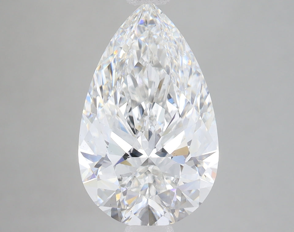 Clear pear-shaped lab-grown diamond with faceted surface and light reflections on neutral background.