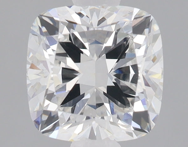Cushion-cut lab-grown diamond with faceted surfaces reflecting light, displayed against a neutral gray background.