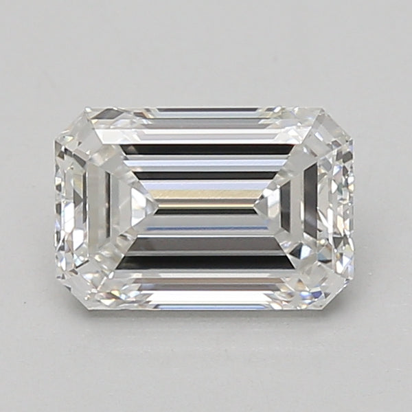 Emerald-cut lab-grown diamond with clear faceting and light reflections on neutral background.