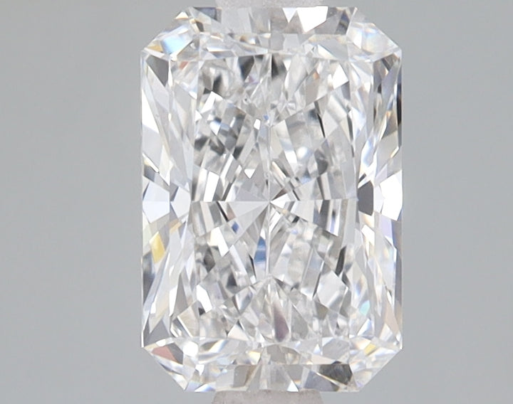 Clear radiant-cut diamond with faceted surfaces reflecting light, displayed against neutral gray background.