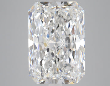 Radiant cut loose diamond with faceted surfaces reflecting light, displayed against neutral gray background.