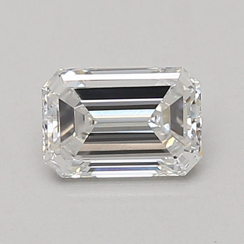Emerald-cut lab-grown diamond loose stone with faceted edges and clear appearance on gray background.