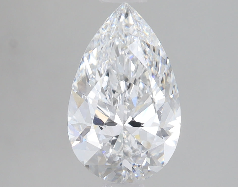 Pear-shaped lab-grown diamond with faceted surface displaying light refraction on gray background.
