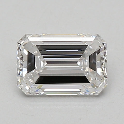 Rectangular emerald-cut lab-grown diamond with faceted sides and clear transparency, displayed against a neutral background.