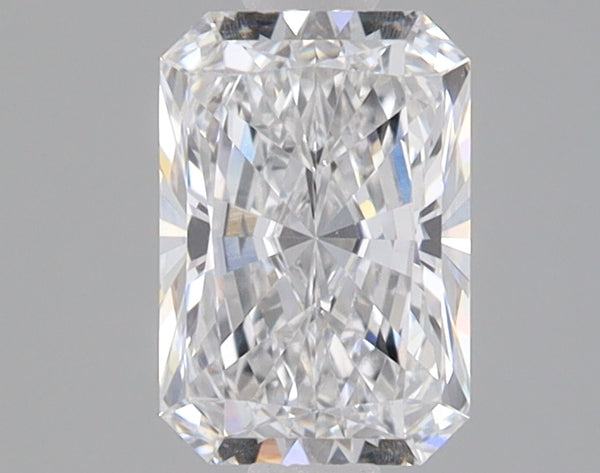 Clear radiant-cut diamond with faceted surfaces reflecting light against a neutral background.