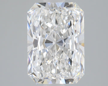 Radiant cut diamond with clear faceting and light reflections on neutral background.