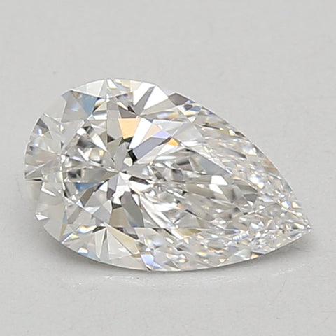 Pear-shaped lab-grown diamond with faceted surface and light reflections on neutral background.