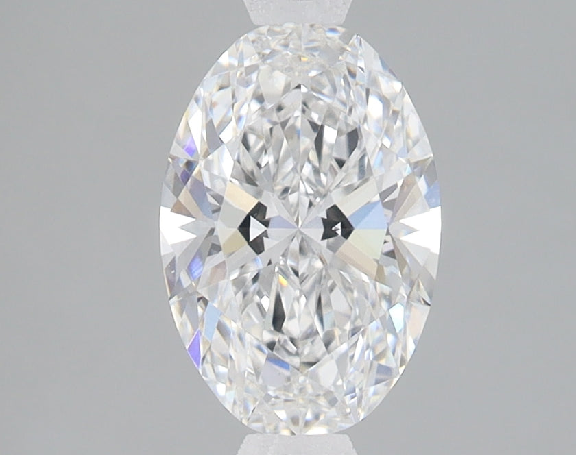 Clear oval-cut diamond with brilliant faceted surfaces and light refraction visible throughout the stone.