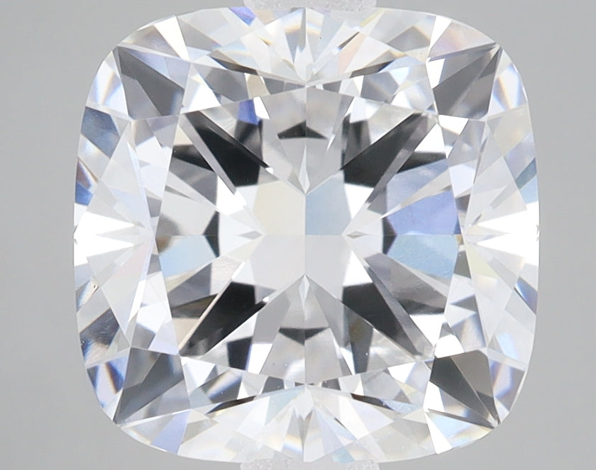 Cushion-cut faceted diamond with brilliant light reflections and internal facet patterns visible throughout the stone.