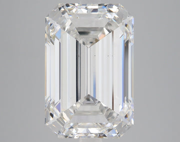 Emerald-cut lab-grown diamond with faceted surfaces and light refraction on gray background.