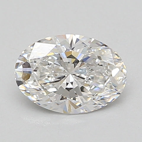 Oval-cut lab-grown diamond with faceted surface displaying light refraction, displayed on neutral background.