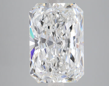 Radiant cut lab grown diamond with faceted surfaces reflecting light, displayed against neutral gray background.