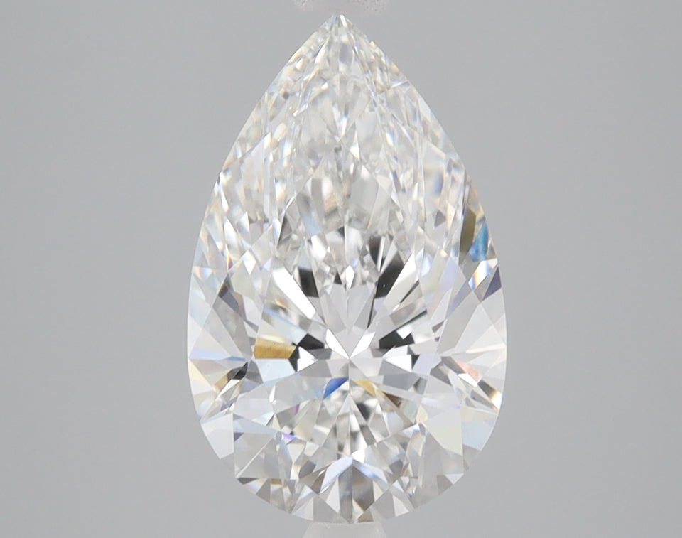 Pear-shaped clear faceted diamond with light reflections on gray background.