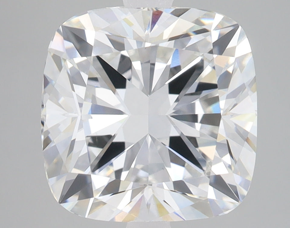 Cushion cut lab grown diamond with brilliant faceting and light refraction on neutral background.