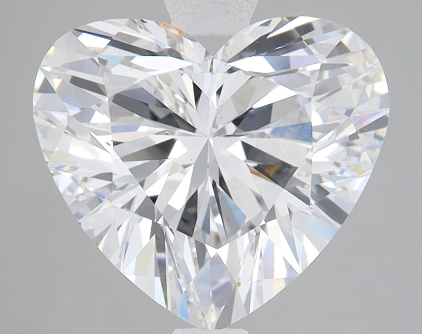 Heart-shaped lab-grown diamond with brilliant faceted cuts displaying light refraction and clarity.