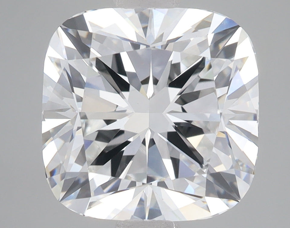 Cushion cut lab-grown diamond with faceted surface displaying light refraction and brilliance against neutral background.