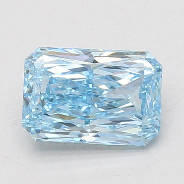 Light blue radiant-cut loose diamond with faceted surfaces, displayed against a white background.