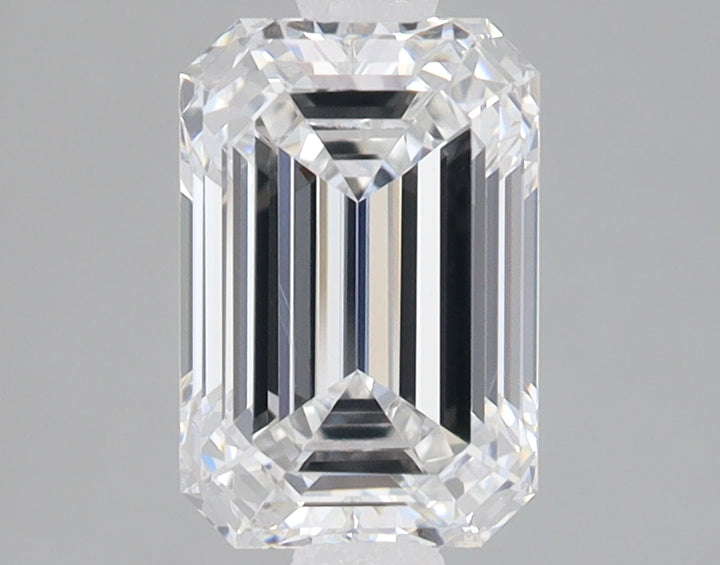 Emerald-cut lab-grown diamond loose stone with faceted surfaces and clear transparency on gray background.