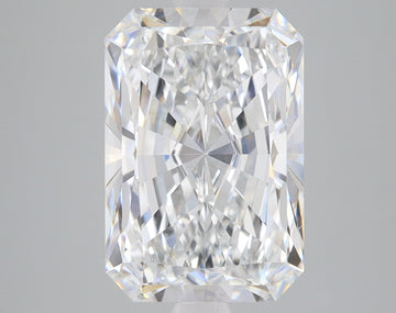 Radiant cut lab grown diamond with faceted surface reflecting light, displayed against neutral gray background.