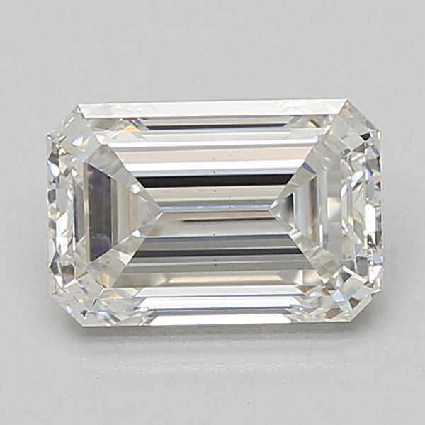 Emerald-cut lab-grown diamond loose stone with faceted surfaces and clear transparency on gray background.