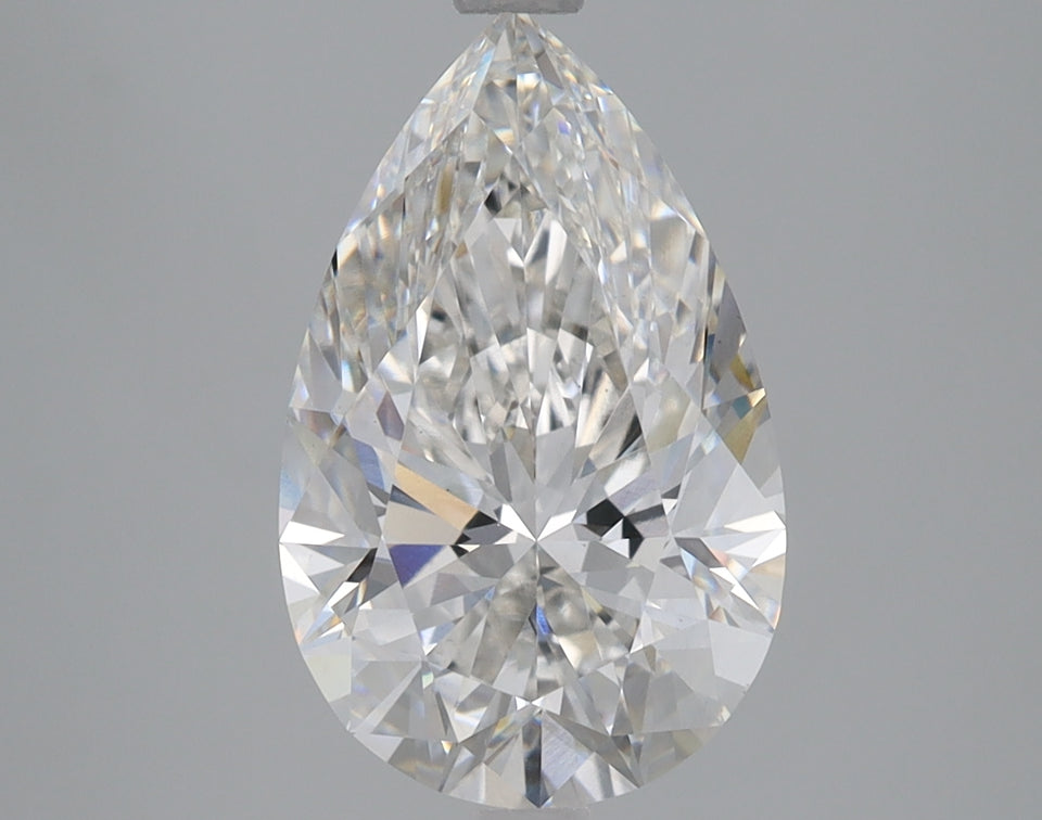 Pear-shaped colorless lab-grown diamond with faceted surfaces and light reflections visible on gray background.