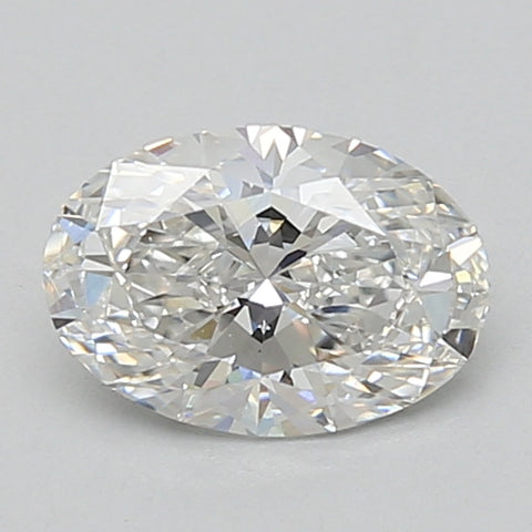 Oval-cut lab grown diamond with faceted surfaces reflecting light, displaying colorless clarity against a neutral gray backgr