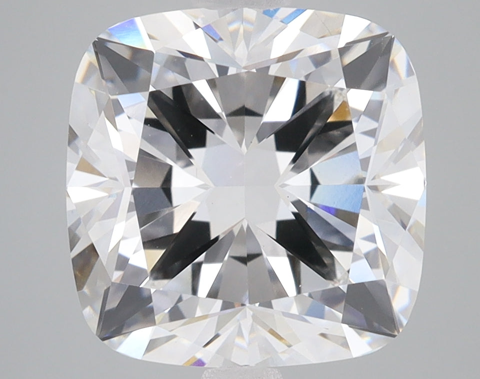 Cushion cut lab-grown diamond with brilliant faceting and light refraction displayed against neutral background.
