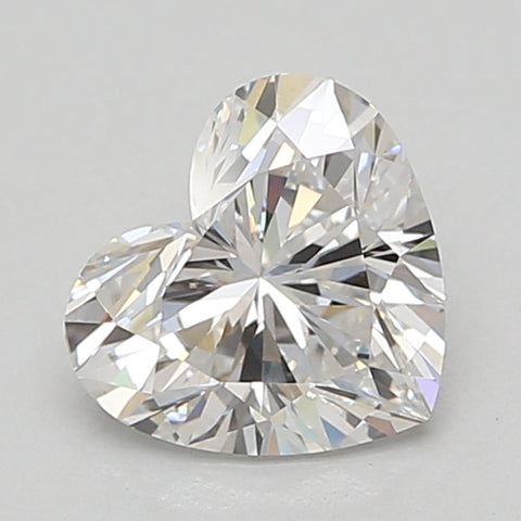 Heart-shaped lab-grown diamond with faceted surfaces reflecting light, colorless appearance.