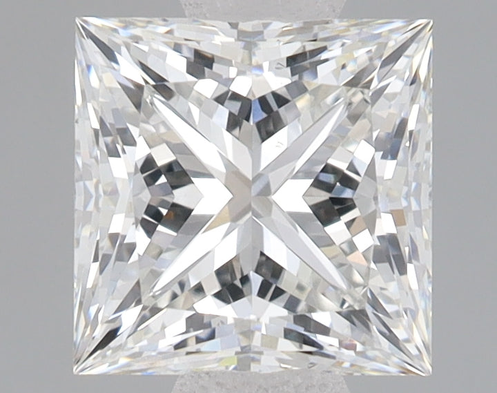 Colorless princess-cut lab grown diamond with faceted surfaces and light reflections on neutral background.
