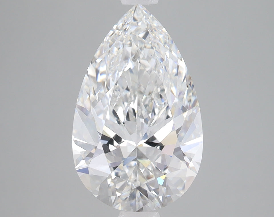Pear-shaped colorless lab-grown diamond with faceted surface reflecting light, displayed against neutral background.