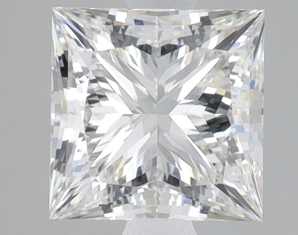 Princess-cut lab grown diamond with faceted surfaces reflecting light, displayed on neutral background.