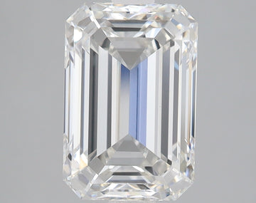 Emerald-cut lab-grown diamond with clear facets and reflective surfaces on neutral background.