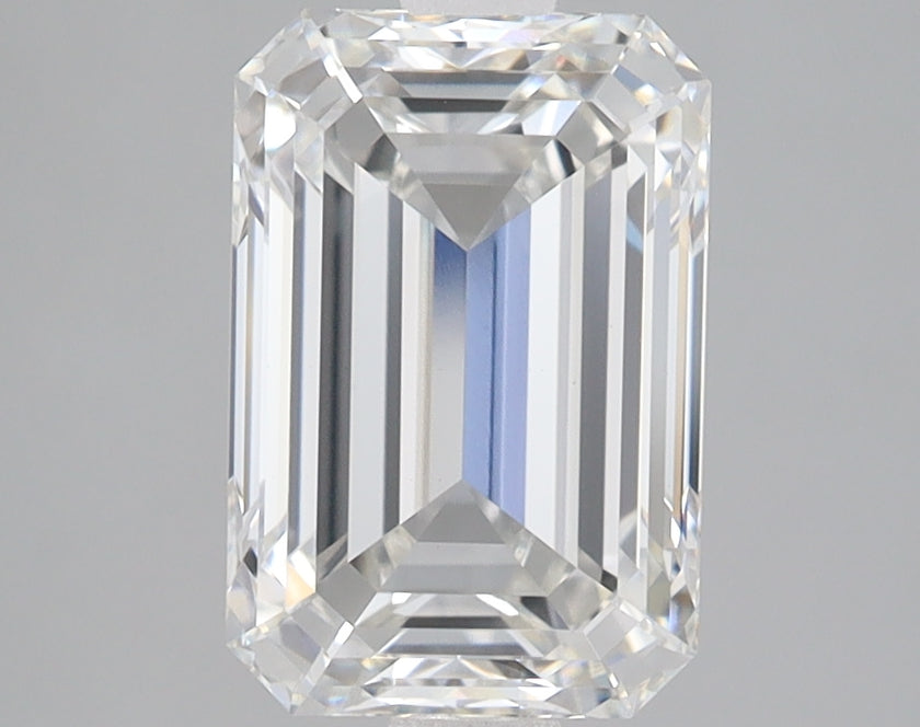 Emerald-cut lab-grown diamond with clear facets and reflective surfaces on neutral background.
