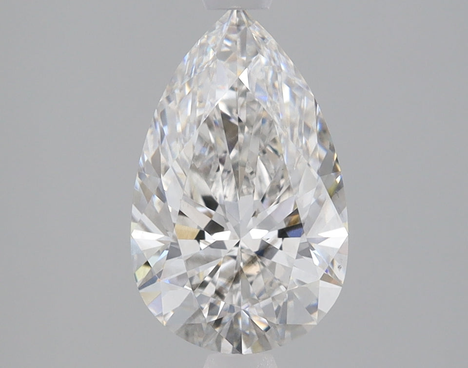 Pear-shaped colorless lab-grown diamond with faceted surfaces displaying light refraction on neutral background.