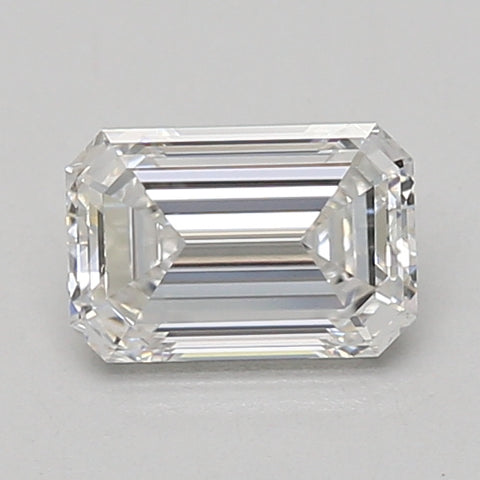 Emerald-cut colorless lab-grown diamond with step facets and beveled corners on neutral background.