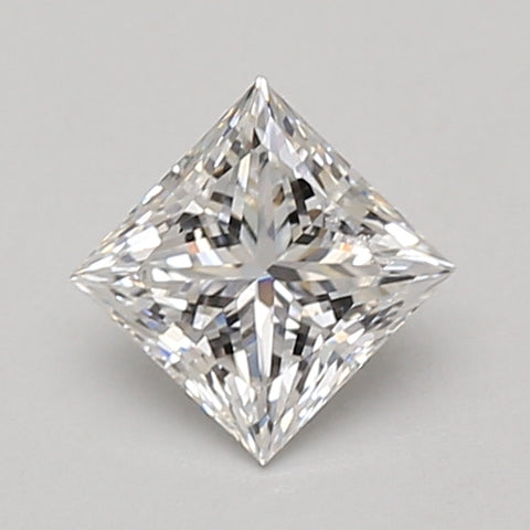 Colorless princess-cut lab-grown diamond with faceted surfaces and sharp edges displayed on neutral background.