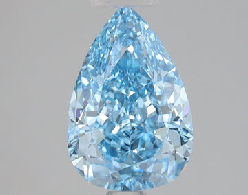 Pear-shaped lab grown diamond with faceted surfaces and light blue tint on neutral background.