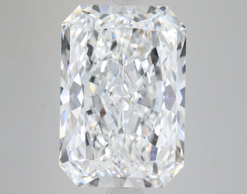 Radiant cut loose diamond with faceted surfaces reflecting light, displayed against neutral background.