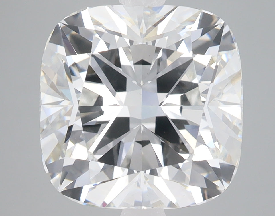 Cushion-cut lab-grown diamond with brilliant faceting and clear transparency, displaying light refraction throughout the ston