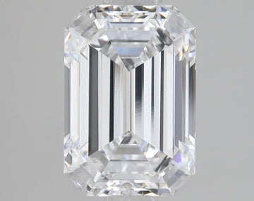 Emerald-cut lab-grown diamond with rectangular facets and step-cut sides, displaying clear light refraction on neutral gray b