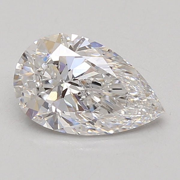 Pear-shaped lab-grown diamond with faceted surface and light reflections on neutral background.