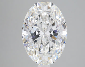 Oval-cut lab-grown diamond with faceted surface reflecting light, displayed against neutral gray background.