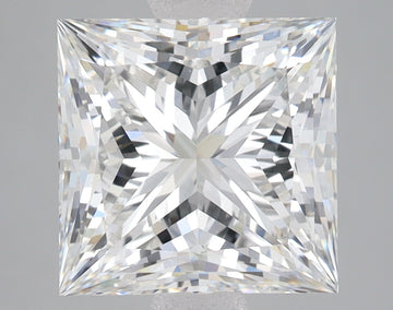 Princess-cut lab-grown diamond with faceted surfaces displaying light refraction patterns against neutral background.