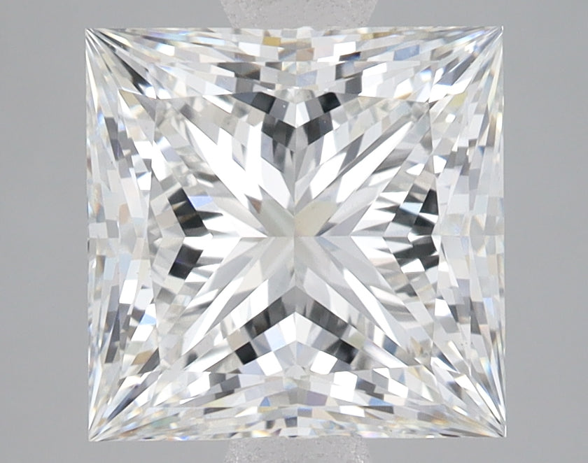 Princess-cut lab-grown diamond with faceted surfaces displaying light refraction patterns against neutral background.