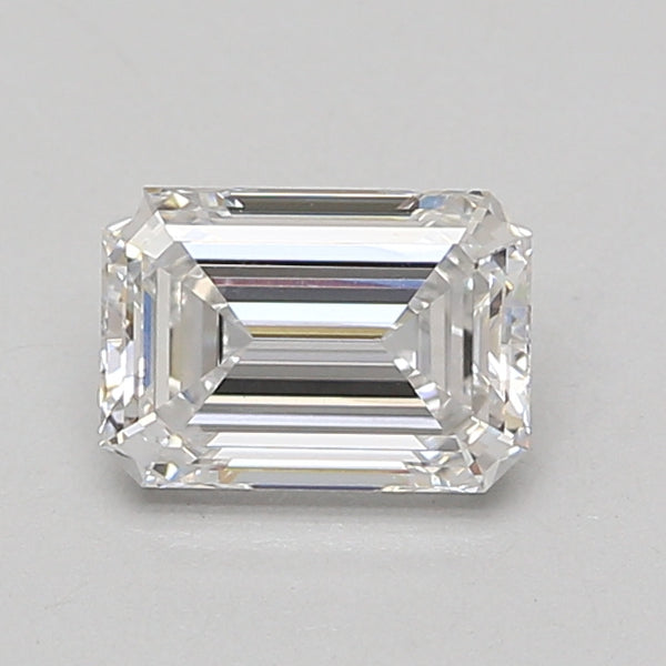 Emerald-cut lab-grown diamond loose stone with faceted surface and clear transparency on neutral background.